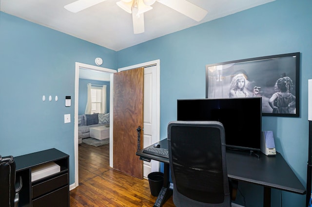 office space featuring wood finished floors and ceiling fan