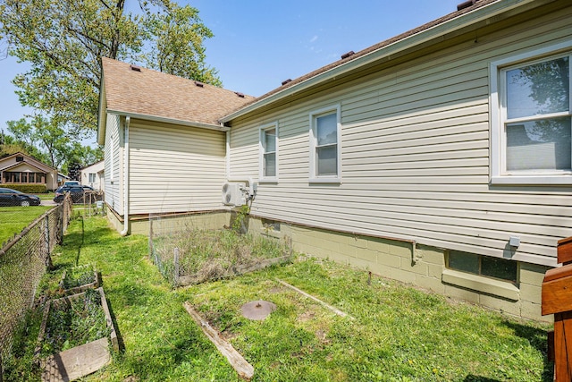 view of side of home featuring a vegetable garden and a cooling unit