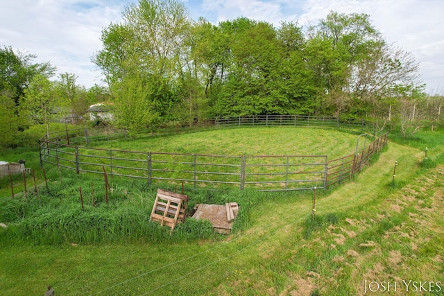 view of yard with fence and a view of rural / pastoral area