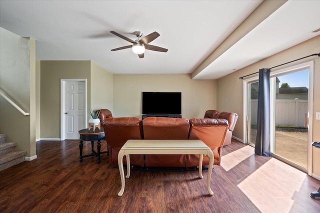 215 Caribou Run, Dundee, MI 48131 - living area featuring wood finished floors, ceiling fan, baseboards, and stairs