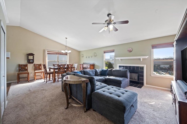 215 Caribou Run, Dundee, MI 48131 - carpeted living room featuring vaulted ceiling, ceiling fan, a chandelier, a tiled fireplace, and baseboards
