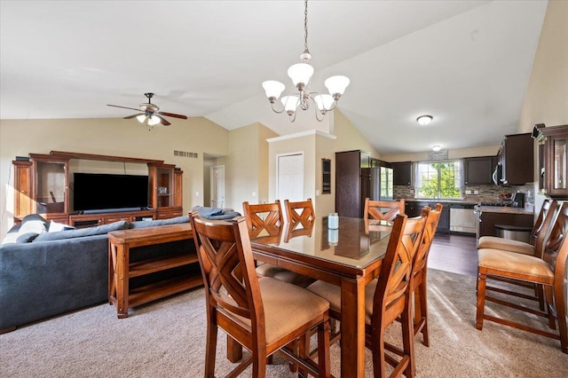 215 Caribou Run, Dundee, MI 48131 - dining space with vaulted ceiling, a chandelier, a ceiling fan, and light colored carpet