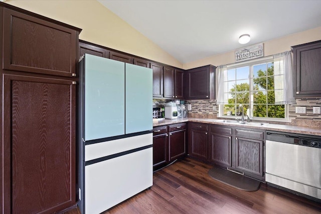 215 Caribou Run, Dundee, MI 48131 - kitchen featuring stainless steel dishwasher, freestanding refrigerator, a sink, backsplash, and lofted ceiling
