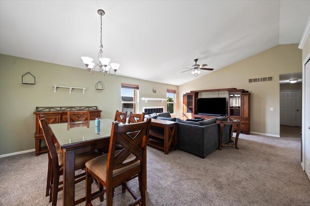 215 Caribou Run, Dundee, MI 48131 - dining area featuring vaulted ceiling, light colored carpet, a ceiling fan, a chandelier, and baseboards