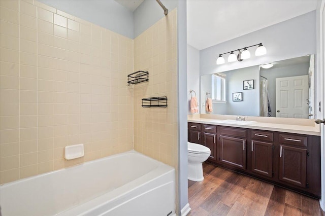 215 Caribou Run, Dundee, MI 48131 - bathroom featuring vanity, wood finished floors, toilet, and shower / bath combination