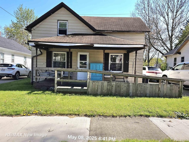 1551 Division St, Saginaw, MI 48602 - view of front of property with covered porch and a shingled roof