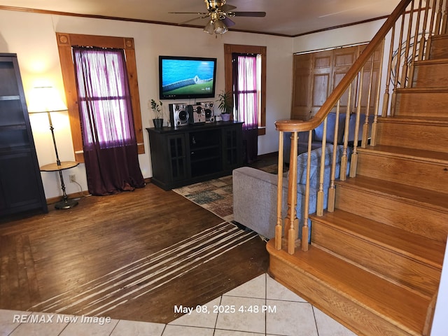 1551 Division St, Saginaw, MI 48602 - stairway featuring ceiling fan, crown molding, and tile patterned floors