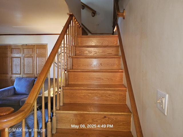 1551 Division St, Saginaw, MI 48602 - stairway featuring crown molding