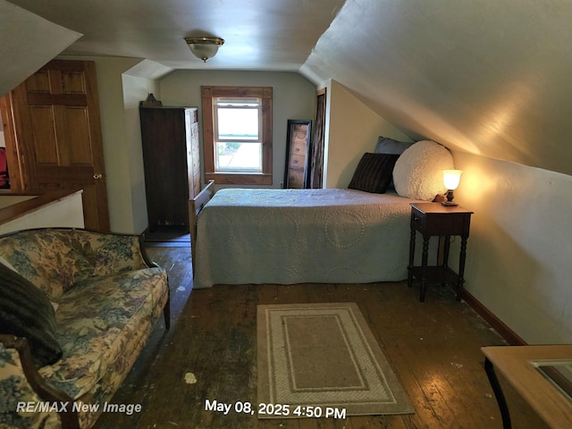 1551 Division St, Saginaw, MI 48602 - bedroom featuring wood-type flooring and lofted ceiling