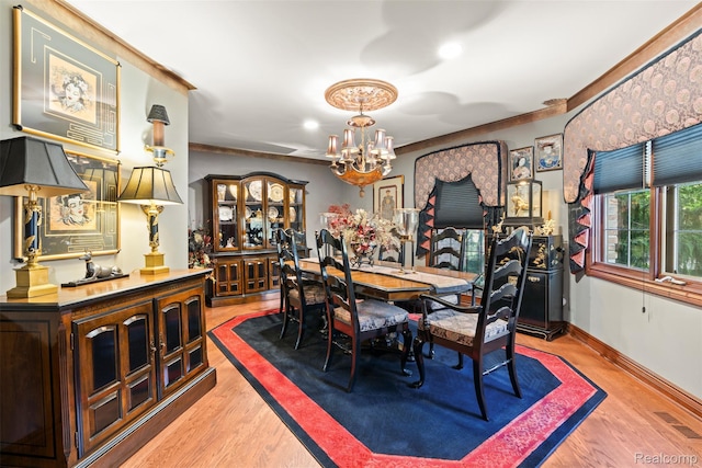 7310 Sandy Creek Ln, Bloomfield Hills, MI 48301 - dining area featuring a chandelier, wood finished floors, and crown molding