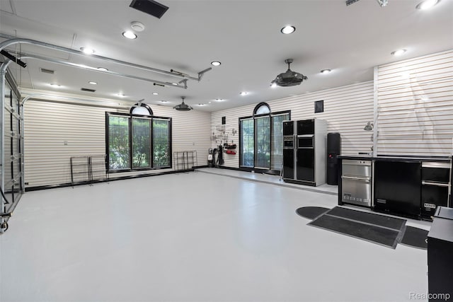 7310 Sandy Creek Ln, Bloomfield Hills, MI 48301 - miscellaneous room with concrete floors, recessed lighting, and a garage