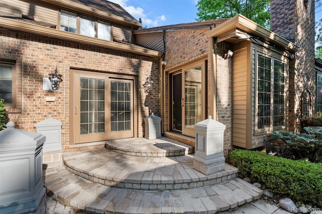 7310 Sandy Creek Ln, Bloomfield Hills, MI 48301 - doorway to property featuring brick siding and a patio
