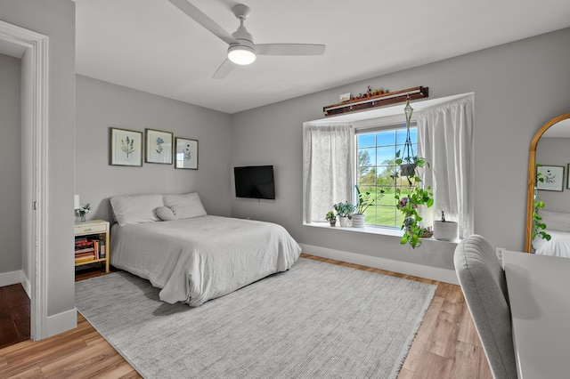 15974 Rustic Ln S, Vicksburg, MI 49097 - bedroom featuring light wood finished floors, baseboards, and a ceiling fan