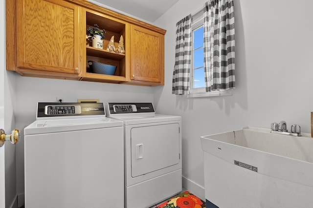 15974 Rustic Ln S, Vicksburg, MI 49097 - laundry area with cabinet space, independent washer and dryer, and baseboards