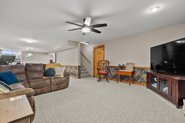 15974 Rustic Ln S, Vicksburg, MI 49097 - carpeted living room with stairway and ceiling fan