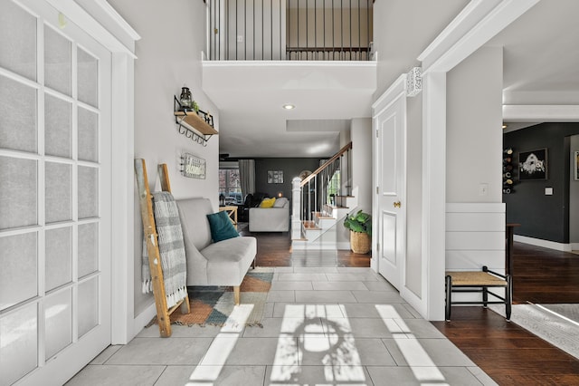15974 Rustic Ln S, Vicksburg, MI 49097 - foyer featuring stairway, a high ceiling, and tile patterned floors