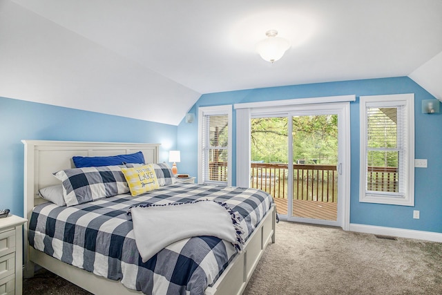 bedroom featuring lofted ceiling, access to exterior, carpet, and baseboards