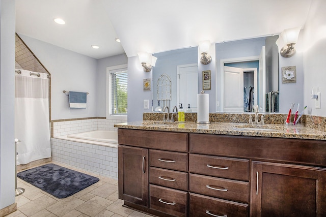 full bath featuring a bath, double vanity, and curtained shower