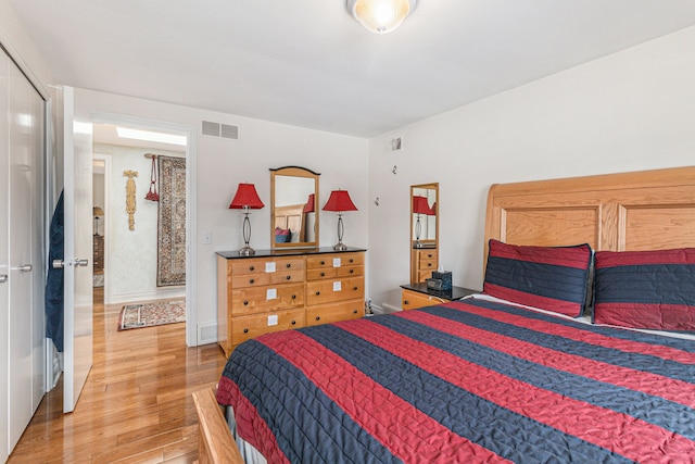 bedroom with wood finished floors
