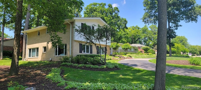 4678 Brightmore Rd, Bloomfield Hills, MI 48302 - view of side of home featuring brick siding and a yard