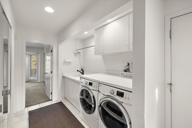 laundry area with cabinet space, independent washer and dryer, light tile patterned flooring, light carpet, and recessed lighting