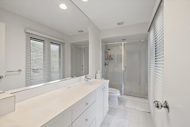 full bath featuring toilet, tile patterned floors, a shower stall, vanity, and recessed lighting