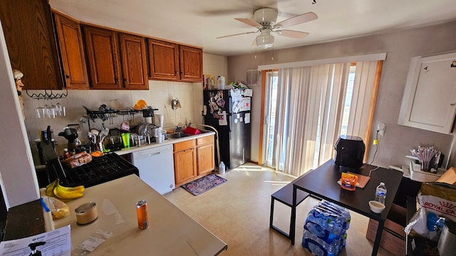26620 Academy St, Roseville, MI 48066 - kitchen with black appliances, light countertops, light flooring, and brown cabinetry