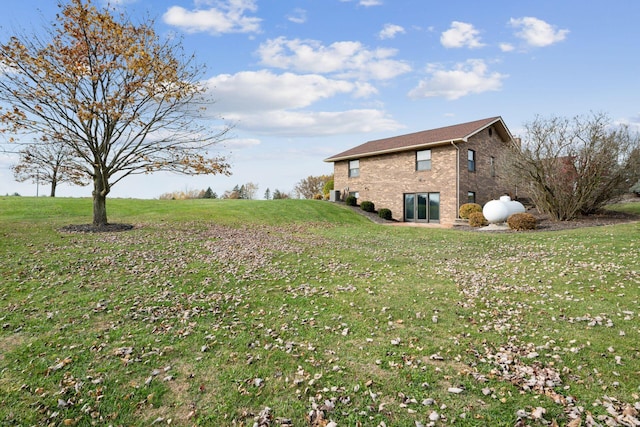 6125 Alber Rd, Saline, MI 48176 - view of property exterior featuring a yard and brick siding