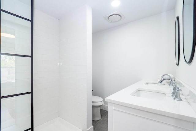 10671 California Rd, Bridgman, MI 49106 - full bathroom with toilet, double vanity, tiled shower, and tile patterned flooring