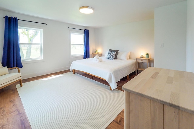 10671 California Rd, Bridgman, MI 49106 - bedroom featuring wood finished floors and baseboards