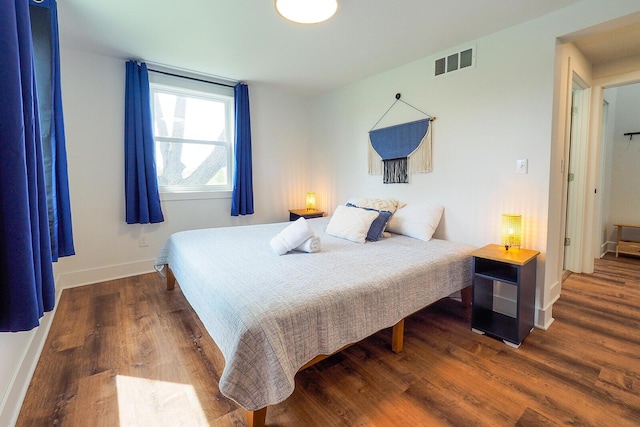 10671 California Rd, Bridgman, MI 49106 - bedroom featuring baseboards and wood finished floors