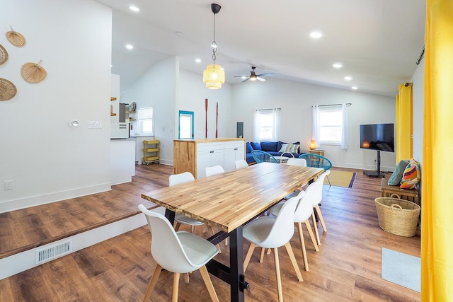 10671 California Rd, Bridgman, MI 49106 - dining room featuring lofted ceiling, a ceiling fan, baseboards, light wood-type flooring, and recessed lighting