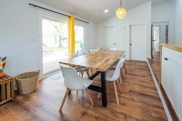 10671 California Rd, Bridgman, MI 49106 - dining area featuring vaulted ceiling and dark wood-type flooring