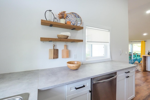 10671 California Rd, Bridgman, MI 49106 - kitchen with white cabinets, wood finished floors, light countertops, dishwasher, and open shelves