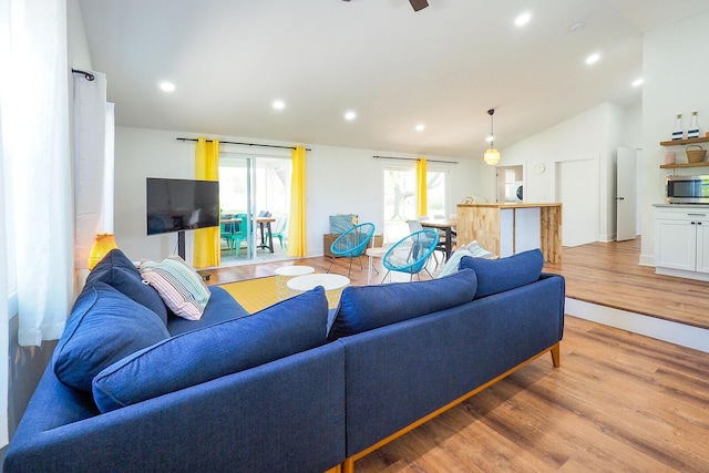 10671 California Rd, Bridgman, MI 49106 - living area with lofted ceiling, light wood-style flooring, recessed lighting, and healthy amount of natural light