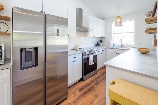 10671 California Rd, Bridgman, MI 49106 - kitchen with appliances with stainless steel finishes, wall chimney range hood, a sink, white cabinetry, and tasteful backsplash