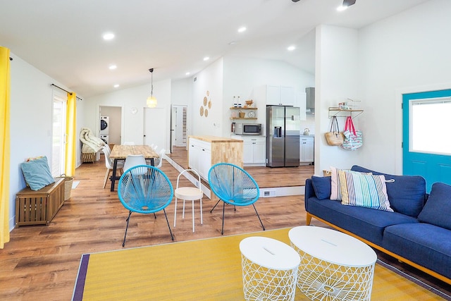 10671 California Rd, Bridgman, MI 49106 - living area with lofted ceiling, healthy amount of natural light, light wood-type flooring, and recessed lighting