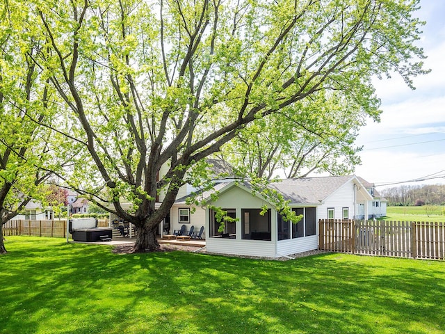 10671 California Rd, Bridgman, MI 49106 - rear view of property with a sunroom, a hot tub, a shingled roof, and a patio area