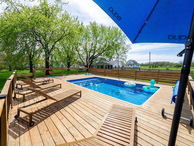10671 California Rd, Bridgman, MI 49106 - view of pool with a wooden deck and fence