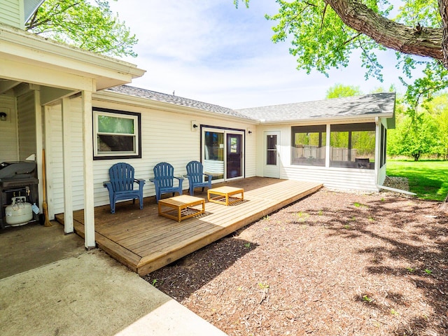 10671 California Rd, Bridgman, MI 49106 - rear view of house featuring a deck, a shingled roof, and a sunroom