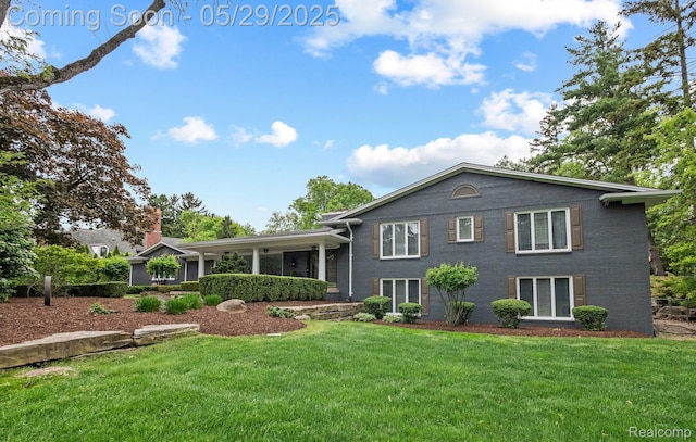 4906 Charing Cross Rd, Bloomfield Hills, MI 48304 - view of front of house featuring a front yard and brick siding