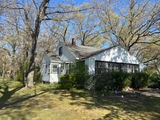 view of front of home featuring a chimney