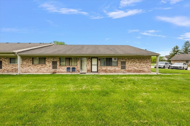 16046 Holz Dr Unit 48, Southgate, MI 48195 - view of front of house with a front lawn, brick siding, and roof with shingles