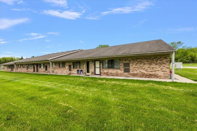 16046 Holz Dr Unit 48, Southgate, MI 48195 - back of house featuring brick siding and a yard
