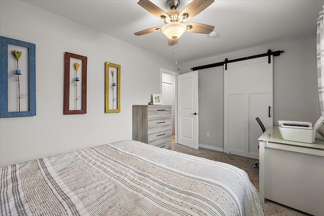 16046 Holz Dr Unit 48, Southgate, MI 48195 - carpeted bedroom featuring a barn door and ceiling fan