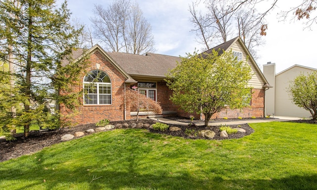 4482 Red Oak Blvd, Waterford, MI 48329 - view of front of home featuring brick siding, a front lawn, and roof with shingles
