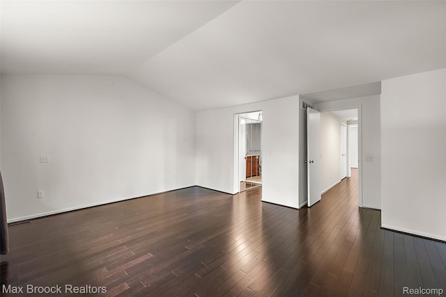 1461 Woodglen Ln Unit G-28, Bloomfield Hills, MI 48304 - empty room with dark wood finished floors and vaulted ceiling