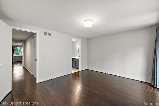 1461 Woodglen Ln Unit G-28, Bloomfield Hills, MI 48304 - empty room with dark wood-style floors and baseboards