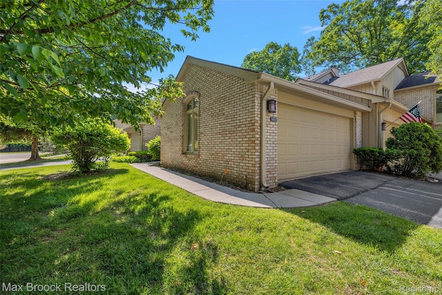 1461 Woodglen Ln Unit G-28, Bloomfield Hills, MI 48304 - view of side of home featuring brick siding, a garage, driveway, and a lawn