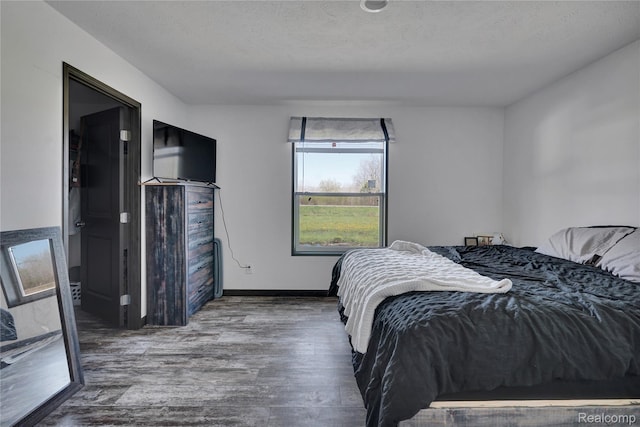 7376 Capac Rd, Yale, MI 48097 - bedroom with wood finished floors and baseboards